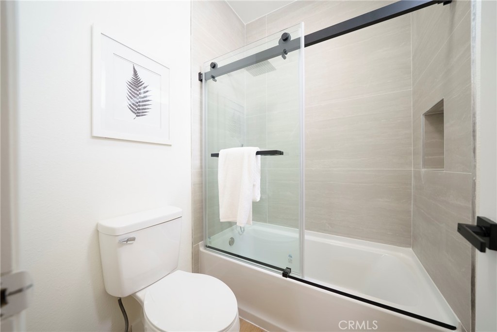104 South Hayworth Avenue, Unit 204 Los Angeles, CA 90048 - Photo 20 of 52 a bathroom with a shower and toilet