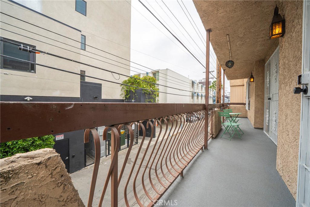 104 South Hayworth Avenue, Unit 204 Los Angeles, CA 90048 - Photo 23 of 52 a view of balcony with wooden floor