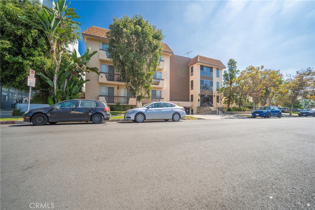 104 South Hayworth Avenue, Unit 204 Los Angeles, CA 90048 - Photo 30 of 52 a car parked in front of a building