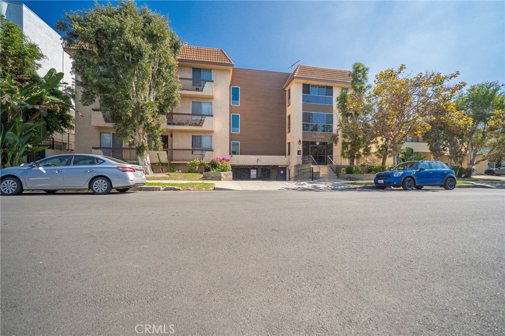 104 South Hayworth Avenue, Unit 204 Los Angeles, CA 90048 - Photo 31 of 52 a buildings with car parked in front of it