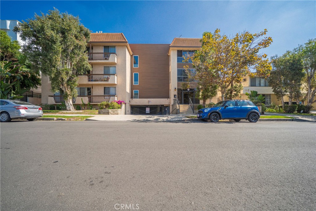 104 South Hayworth Avenue, Unit 204 Los Angeles, CA 90048 - Photo 32 of 52 a cars parked in front of a building