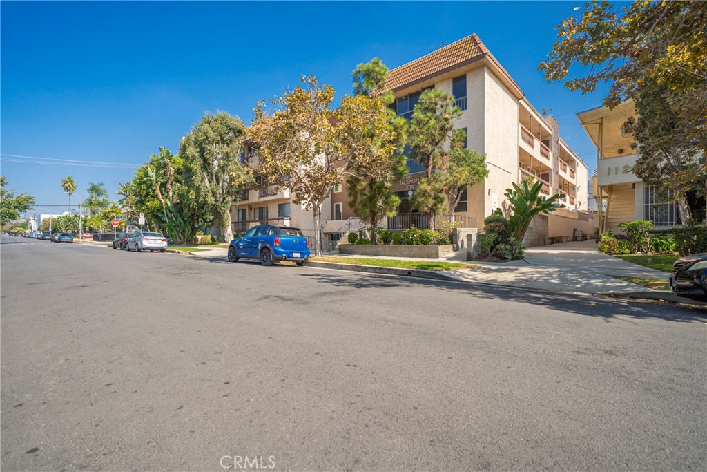 104 South Hayworth Avenue, Unit 204 Los Angeles, CA 90048 - Photo 34 of 52 a view of street along with trees