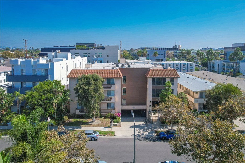104 South Hayworth Avenue, Unit 204 Los Angeles, CA 90048 - Photo 40 of 52 a view of a house with a yard and sitting area