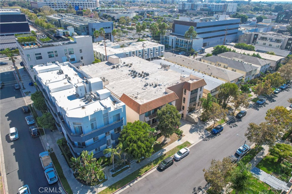 104 South Hayworth Avenue, Unit 204 Los Angeles, CA 90048 - Photo 41 of 52 an aerial view of a house with a yard and garden view