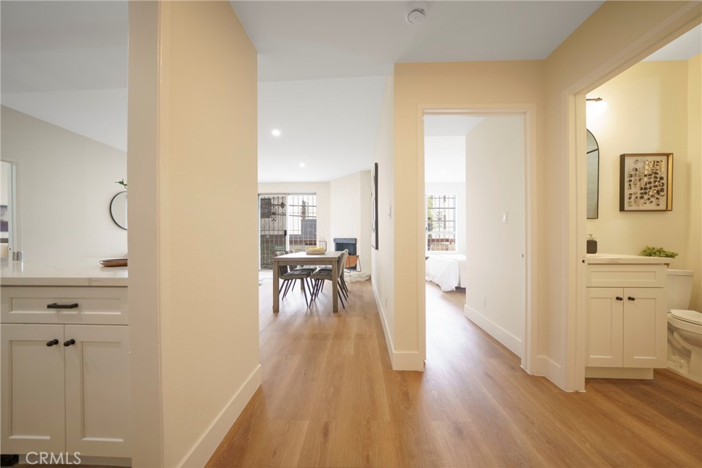 104 South Hayworth Avenue, Unit 204 Los Angeles, CA 90048 - Photo 8 of 52 a view of a hallway with wooden floor a sink and windows