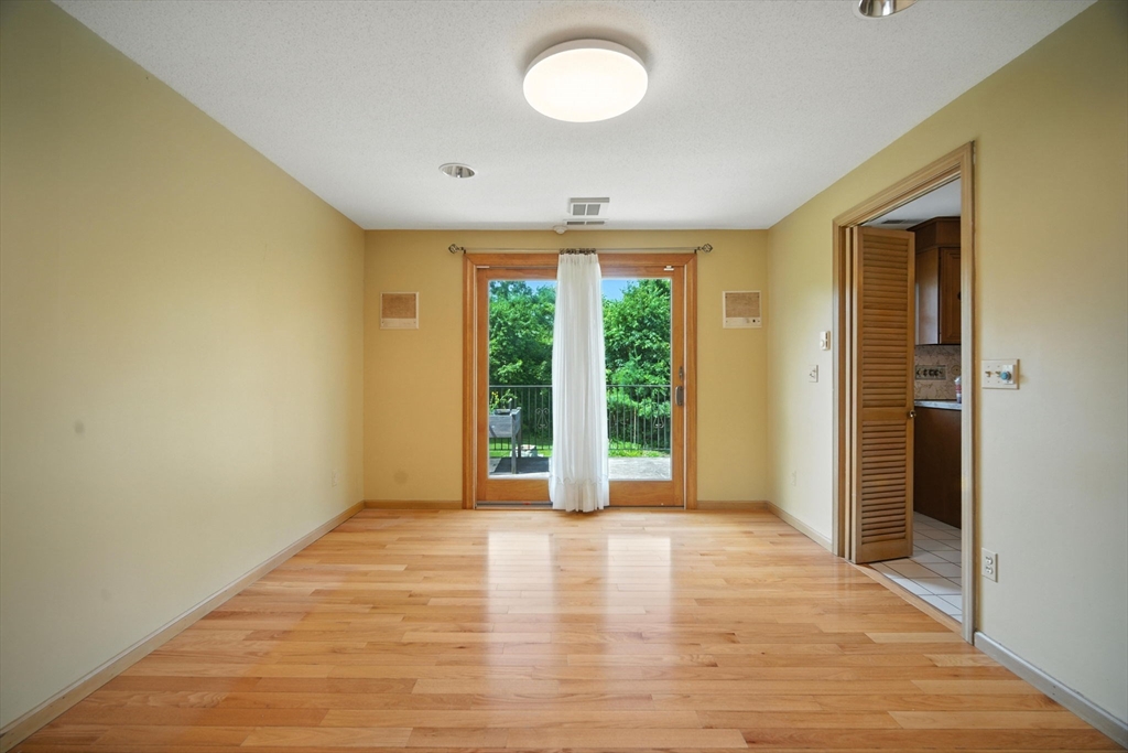 22 Woodland Road Springfield, MA 01129 - Photo 11 of 36 a view of an empty room with a window