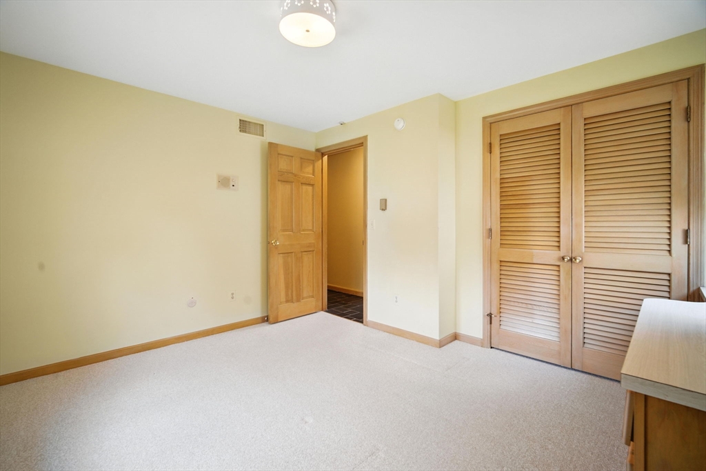 22 Woodland Road Springfield, MA 01129 - Photo 20 of 36 a view of an empty room with a window