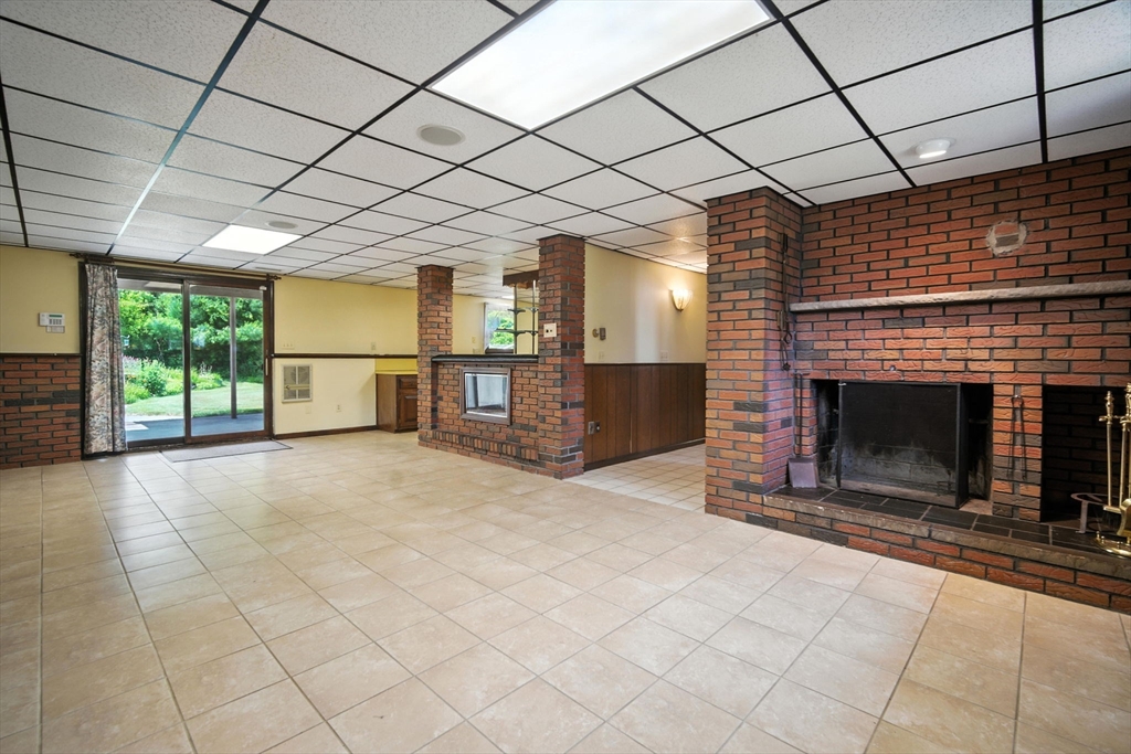 22 Woodland Road Springfield, MA 01129 - Photo 26 of 36 a view of empty room with fireplace and windows