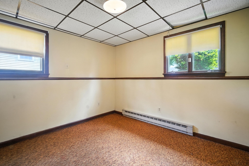 22 Woodland Road Springfield, MA 01129 - Photo 33 of 36 a view of a room with rack on the wall and a window