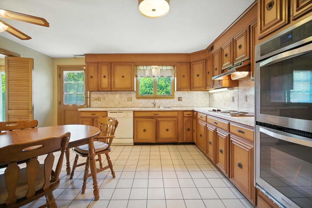 22 Woodland Road Springfield, MA 01129 - Photo 6 of 36 a kitchen with a sink cabinets and window