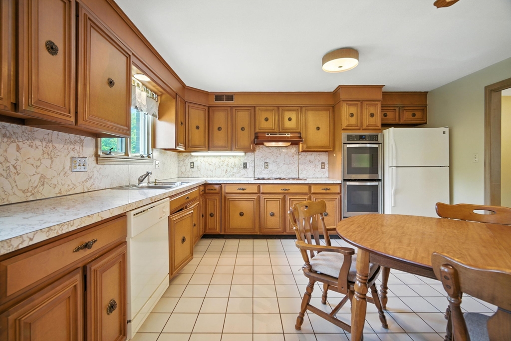 22 Woodland Road Springfield, MA 01129 - Photo 8 of 36 a kitchen with a sink a counter space and appliances