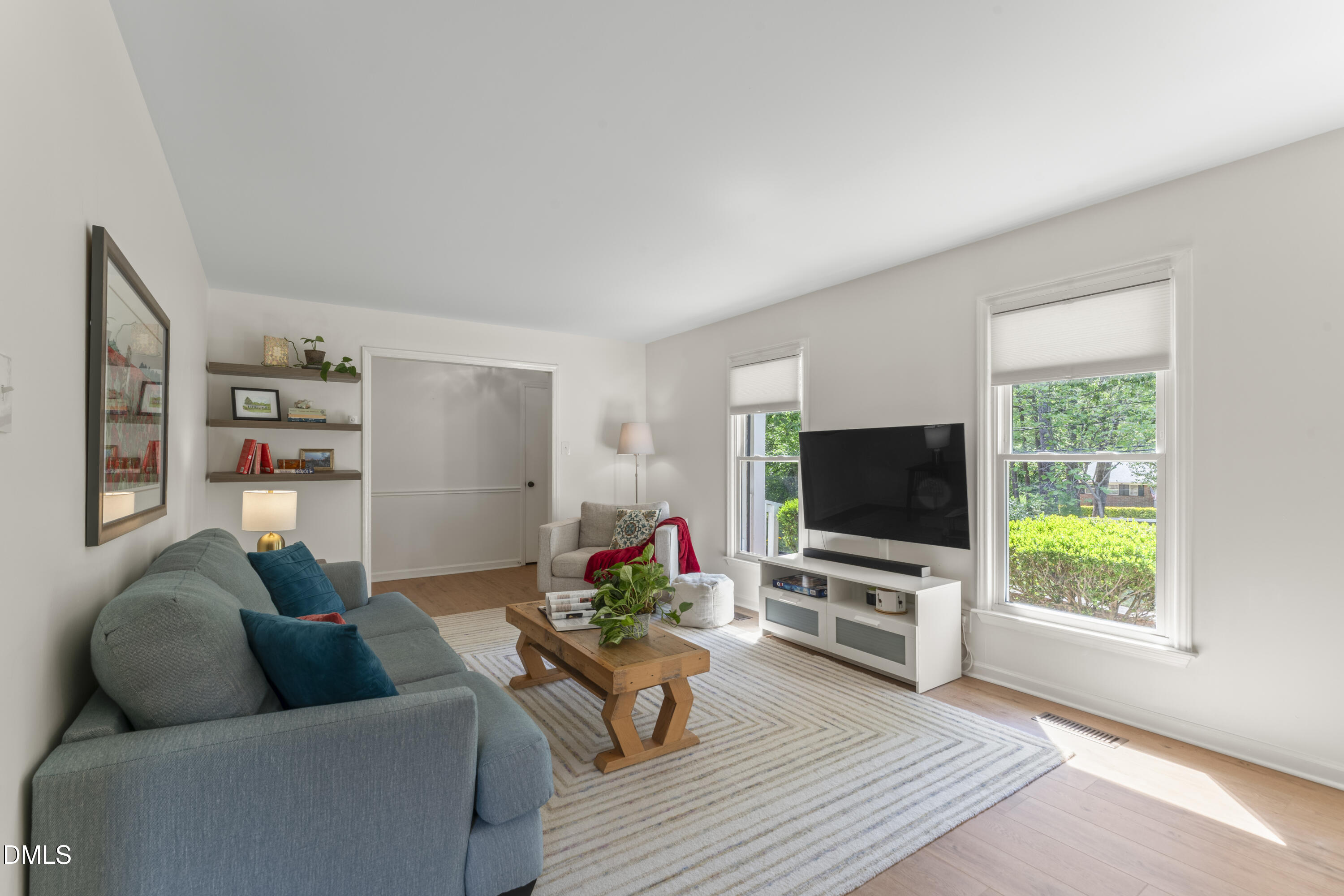 3419 Old Chapel Hill Road Durham, NC 27707 - Photo 12 of 38 a living room with furniture and a flat screen tv