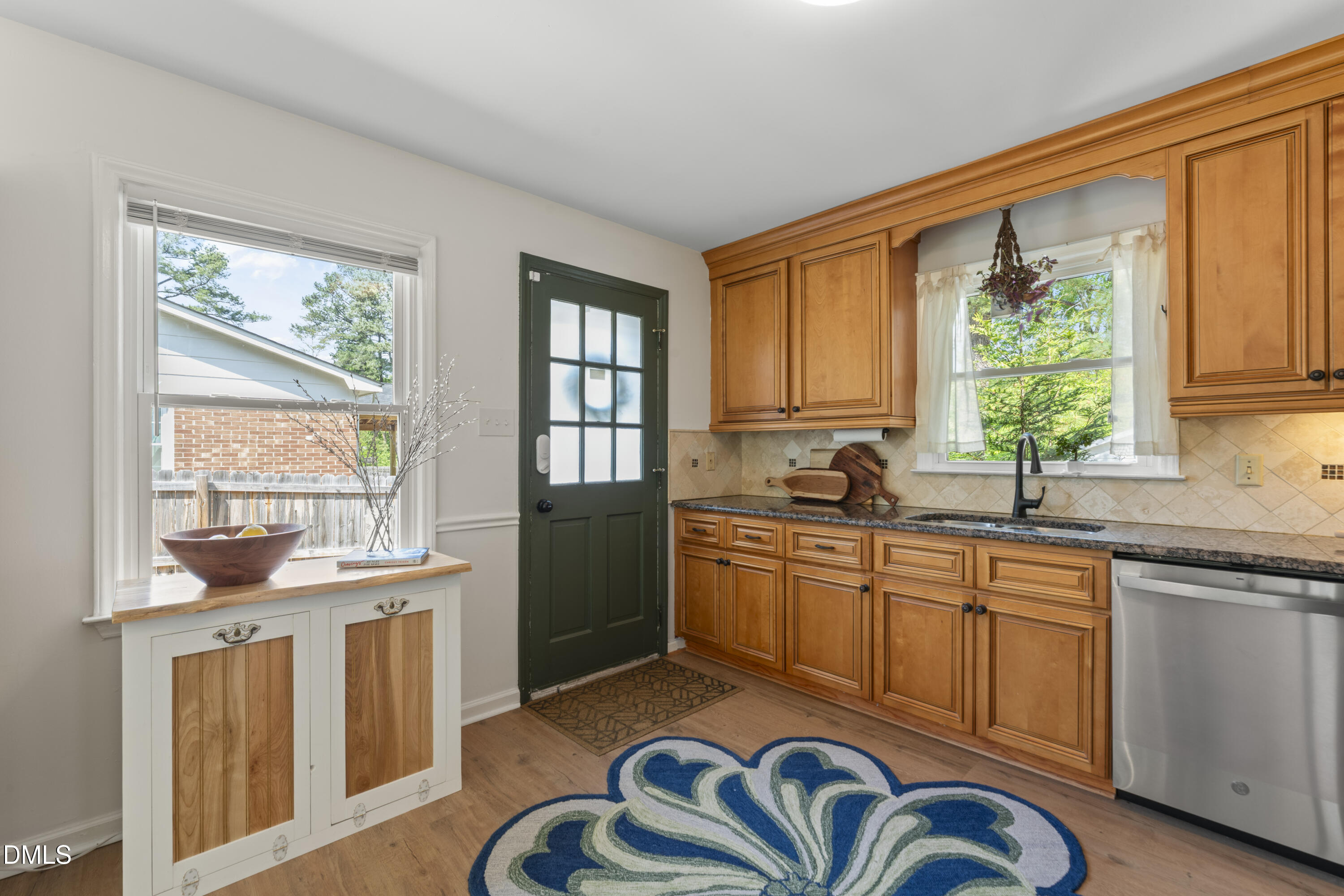 3419 Old Chapel Hill Road Durham, NC 27707 - Photo 17 of 38 a kitchen with a sink stove and cabinets