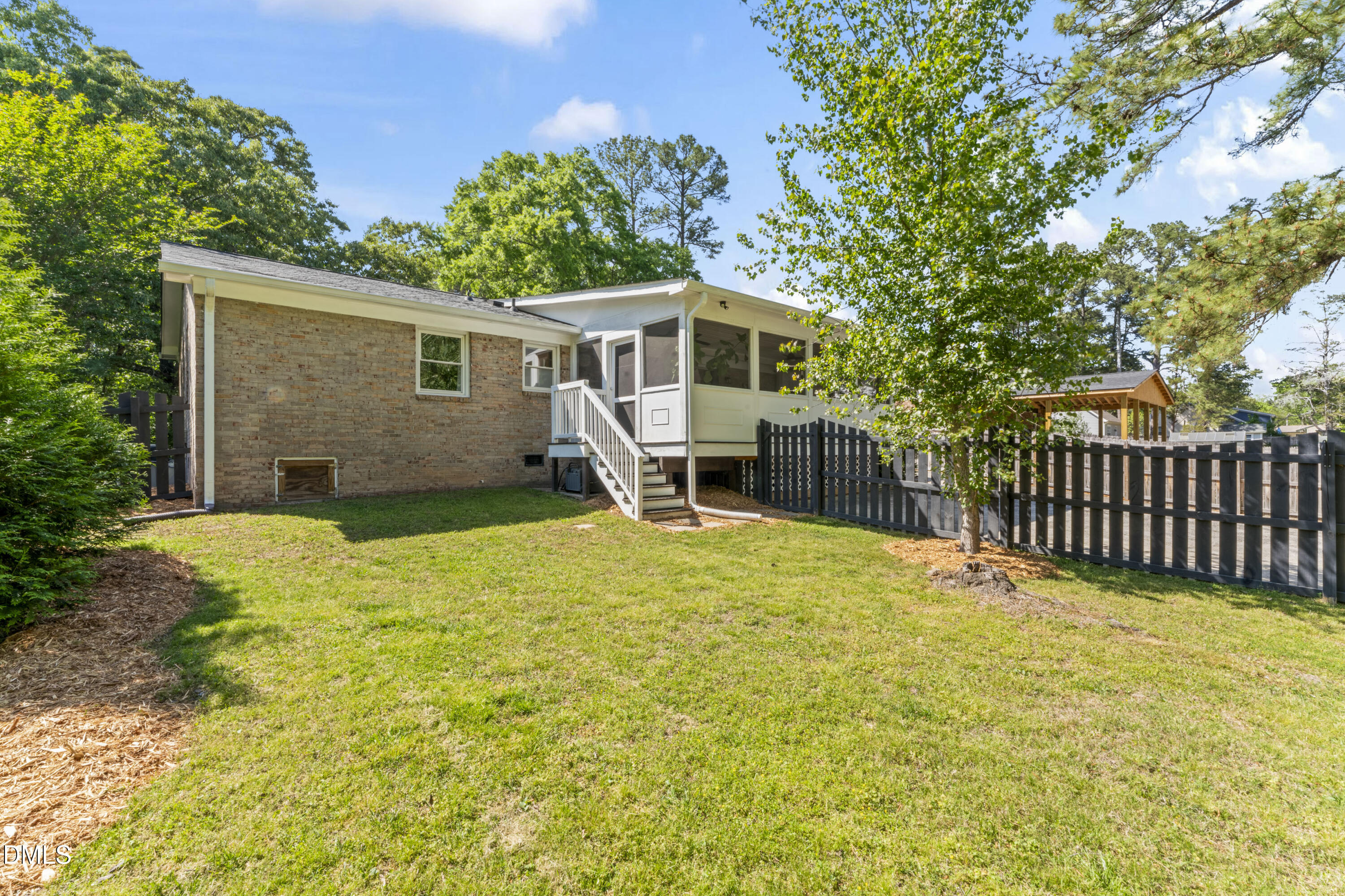 3419 Old Chapel Hill Road Durham, NC 27707 - Photo 30 of 38 a front view of a house with a garden and deck