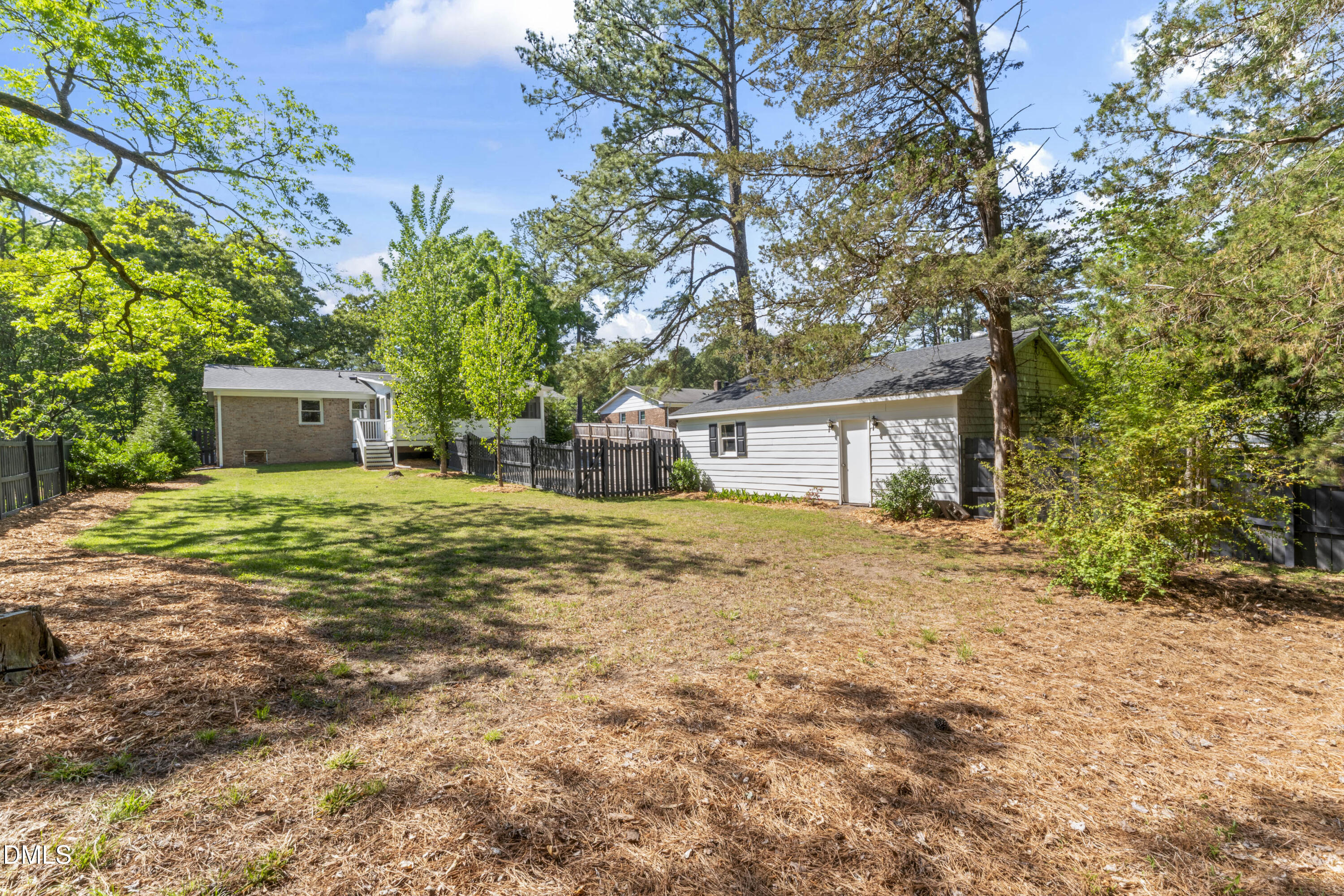 3419 Old Chapel Hill Road Durham, NC 27707 - Photo 32 of 38 a big house with a big yard and large trees