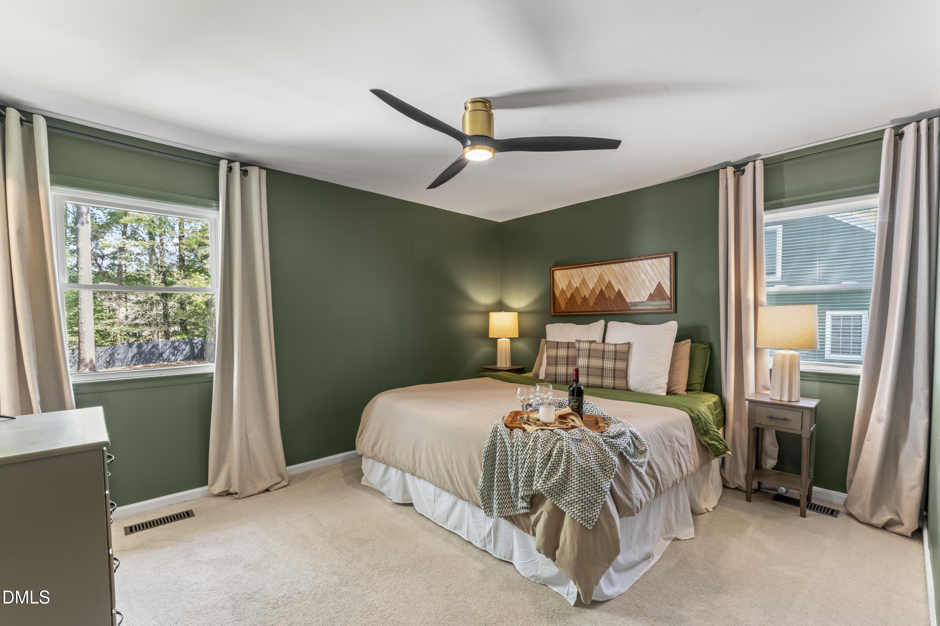 3419 Old Chapel Hill Road Durham, NC 27707 - Photo 5 of 38 a bedroom with a bed a window and a chandelier