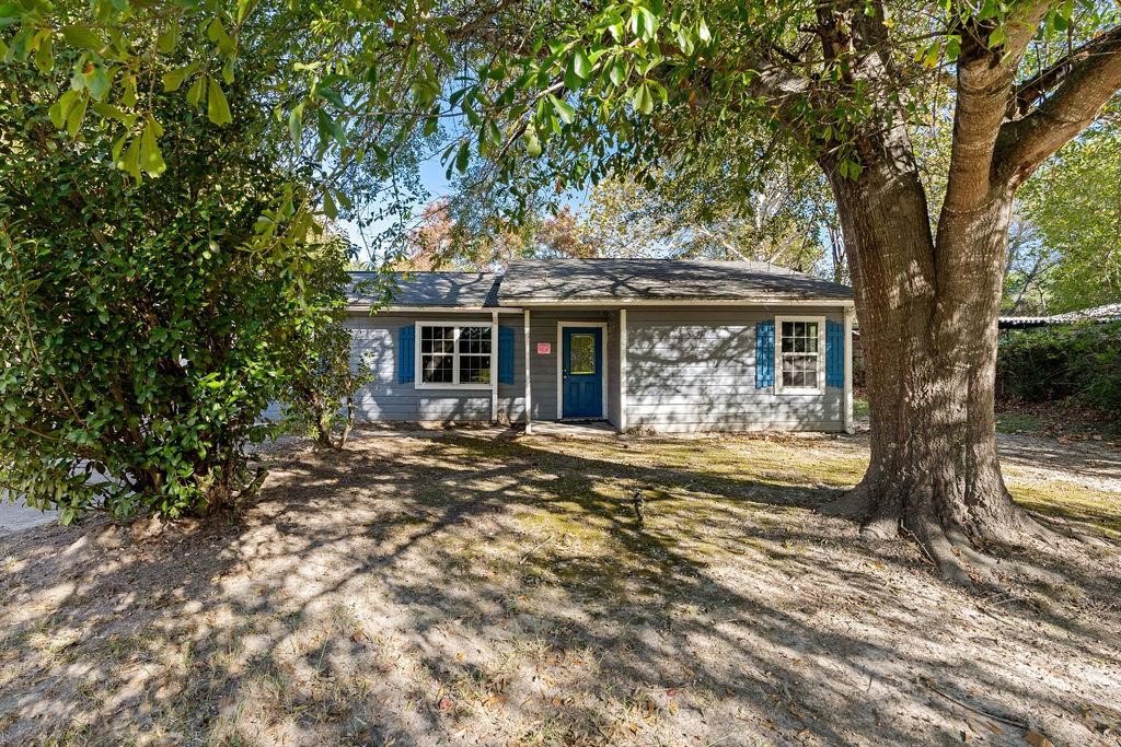 a view of house with yard