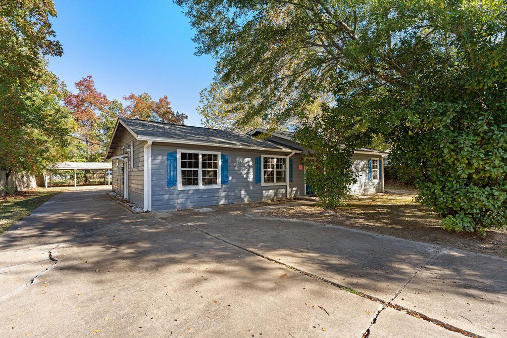 2915 Freeman Street Lufkin, TX 75901 - Photo 13 of 31 a front view of a house with a garden