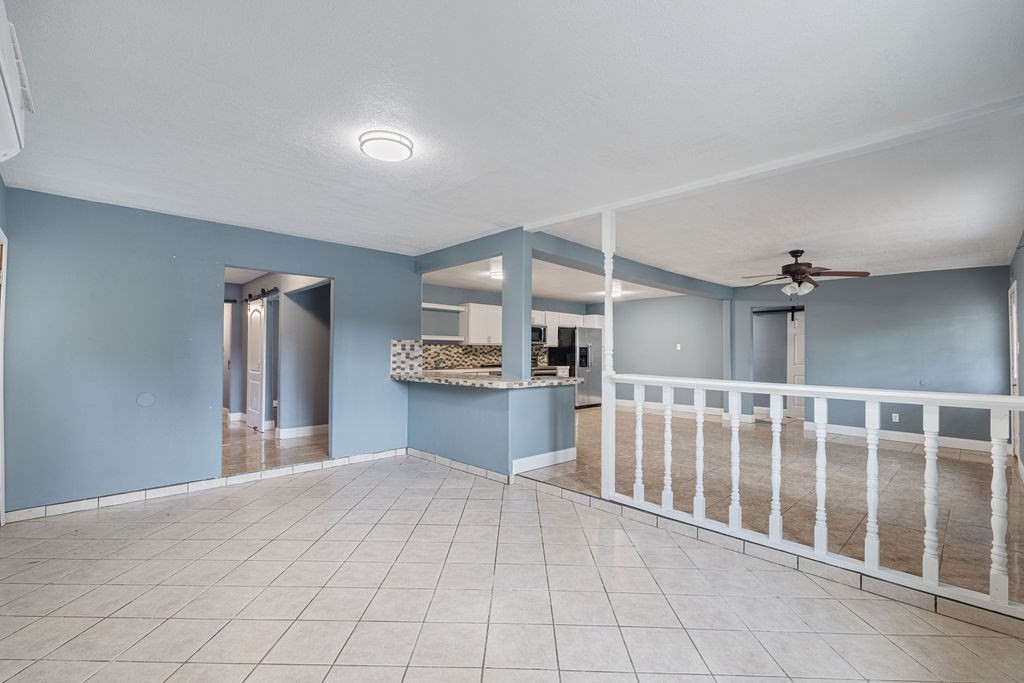 2915 Freeman Street Lufkin, TX 75901 - Photo 16 of 31 a view of a kitchen with furniture and an empty room