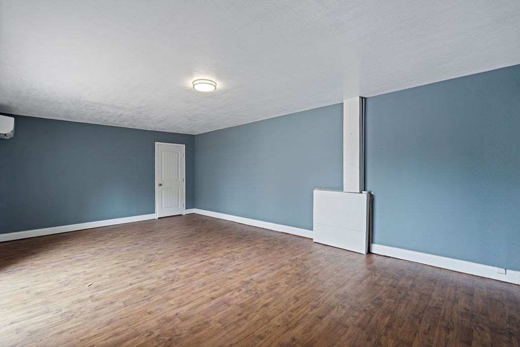 2915 Freeman Street Lufkin, TX 75901 - Photo 27 of 31 a view of an empty room with wooden floor