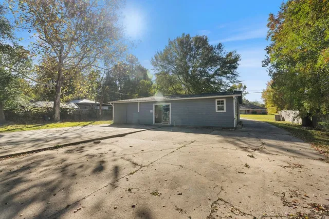 a house with trees in the background