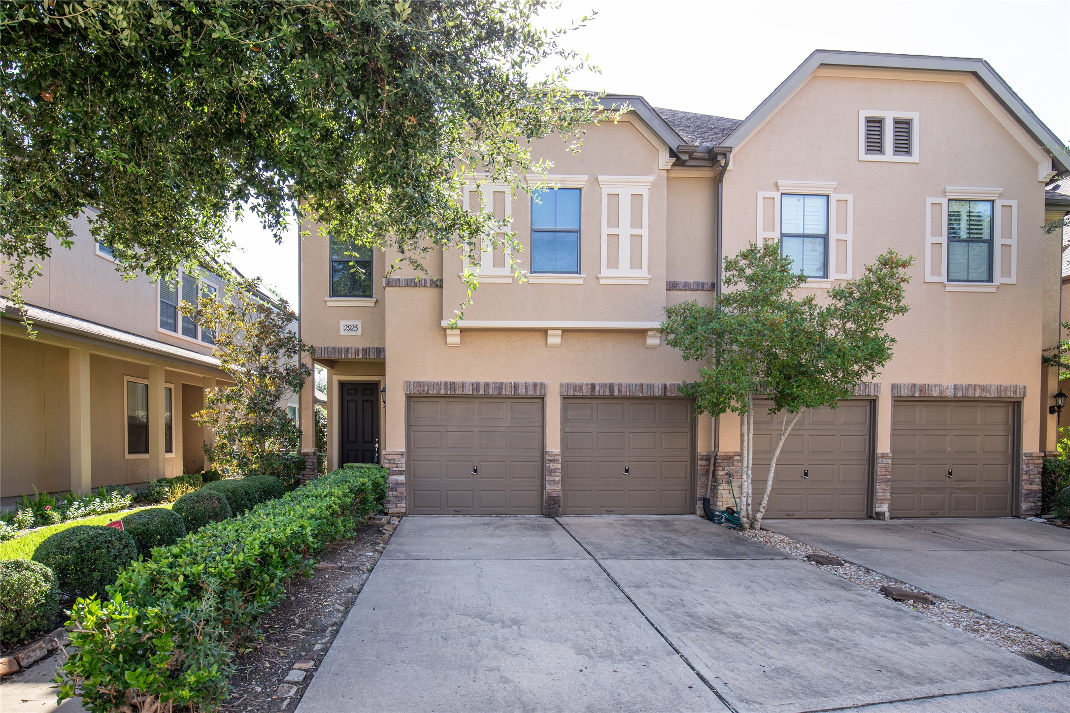2923 Royal Oaks Crest Houston, TX 77082 - Photo 1 of 31 a front view of a house with a yard and garage