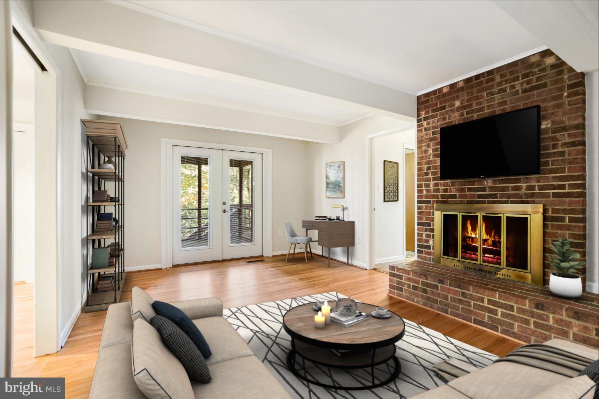 2606 Deerdell Lane Reston, VA 20191 - Photo 17 of 49 a living room with fireplace furniture and a flat screen tv