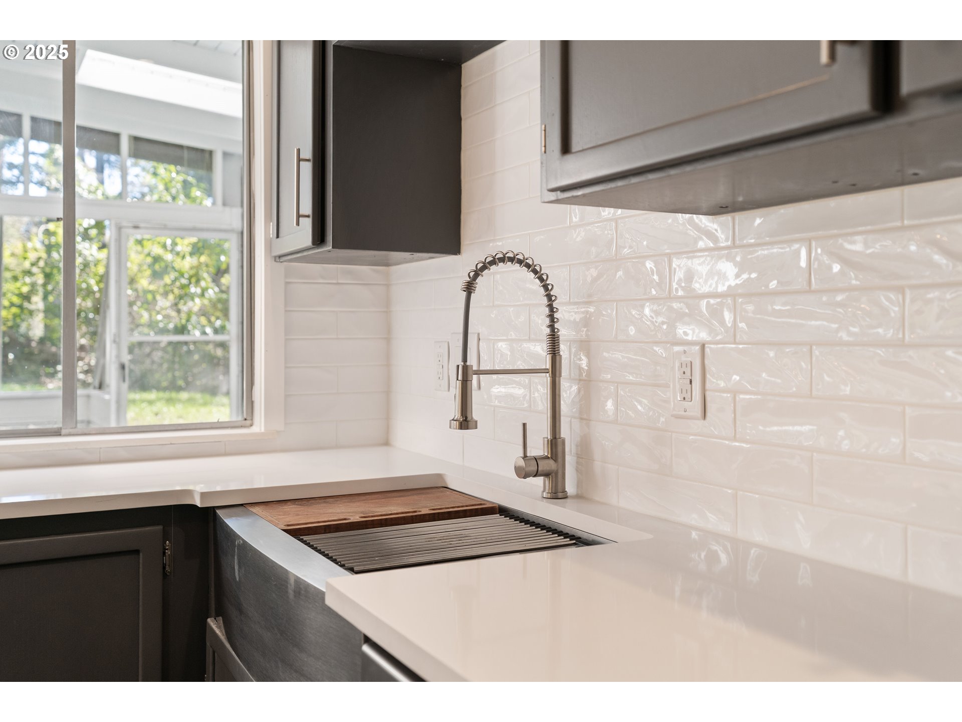 4778 Southeast Naef Road Milwaukie, OR 97267 - Photo 14 of 43 a kitchen with a stove a sink and a window