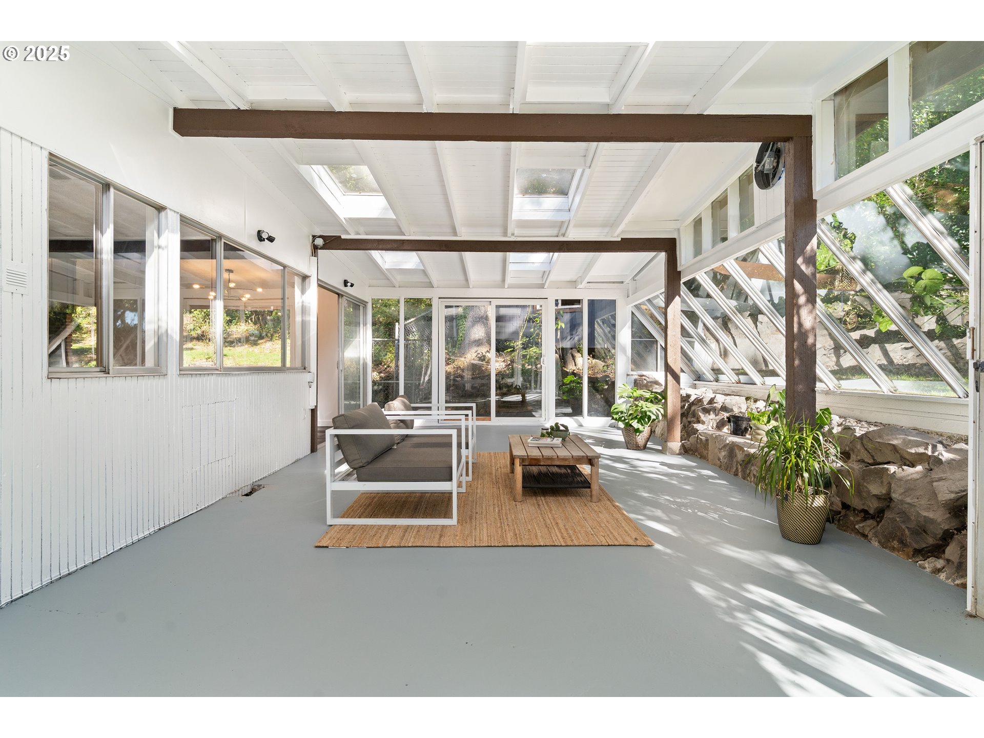 4778 Southeast Naef Road Milwaukie, OR 97267 - Photo 19 of 43 a living room with furniture and a large window
