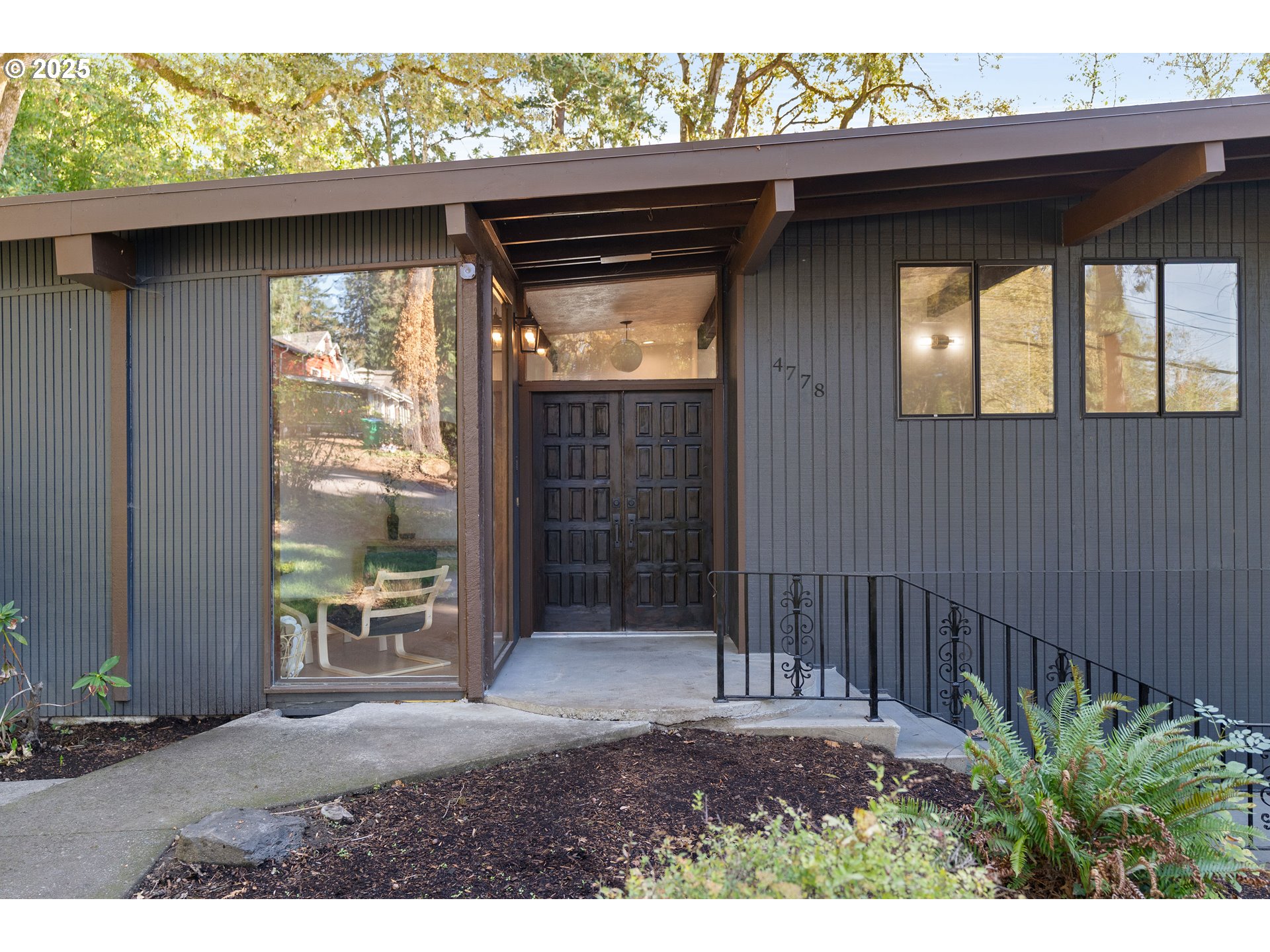 4778 Southeast Naef Road Milwaukie, OR 97267 - Photo 2 of 43 a backyard of a house with table and chairs