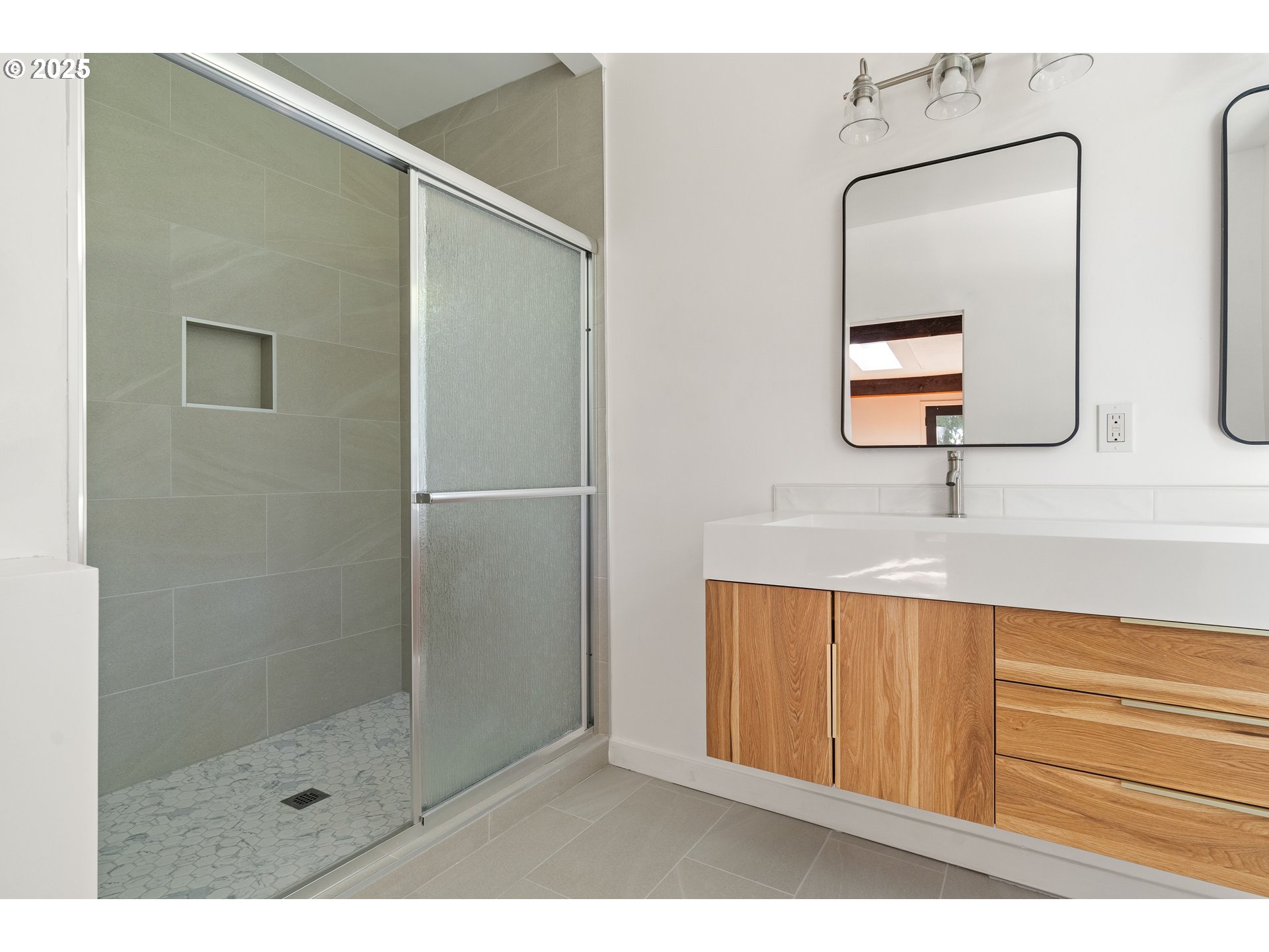 4778 Southeast Naef Road Milwaukie, OR 97267 - Photo 23 of 43 a bathroom with a shower a sink and a mirror