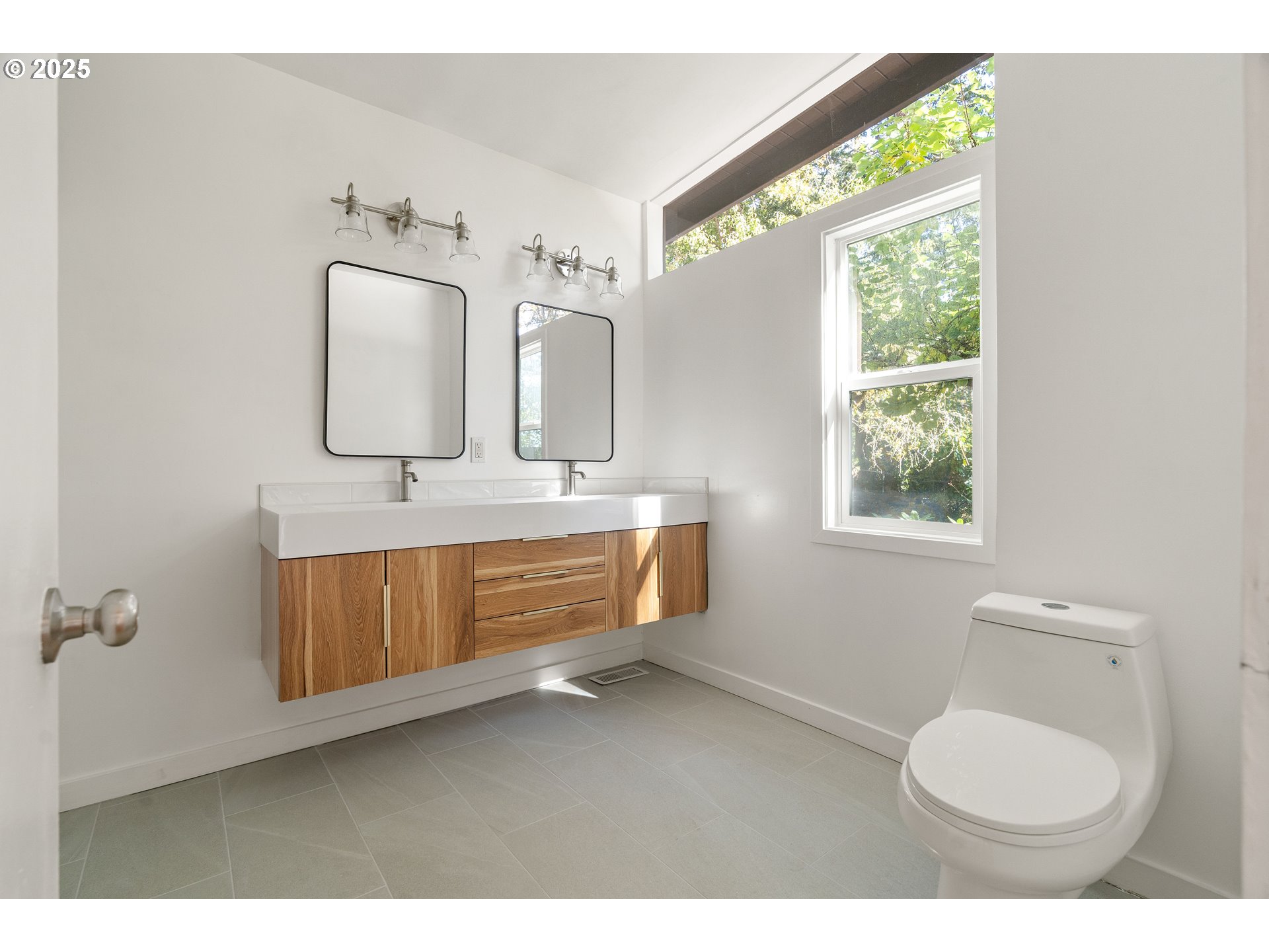 4778 Southeast Naef Road Milwaukie, OR 97267 - Photo 24 of 43 a bathroom with a toilet sink and mirror