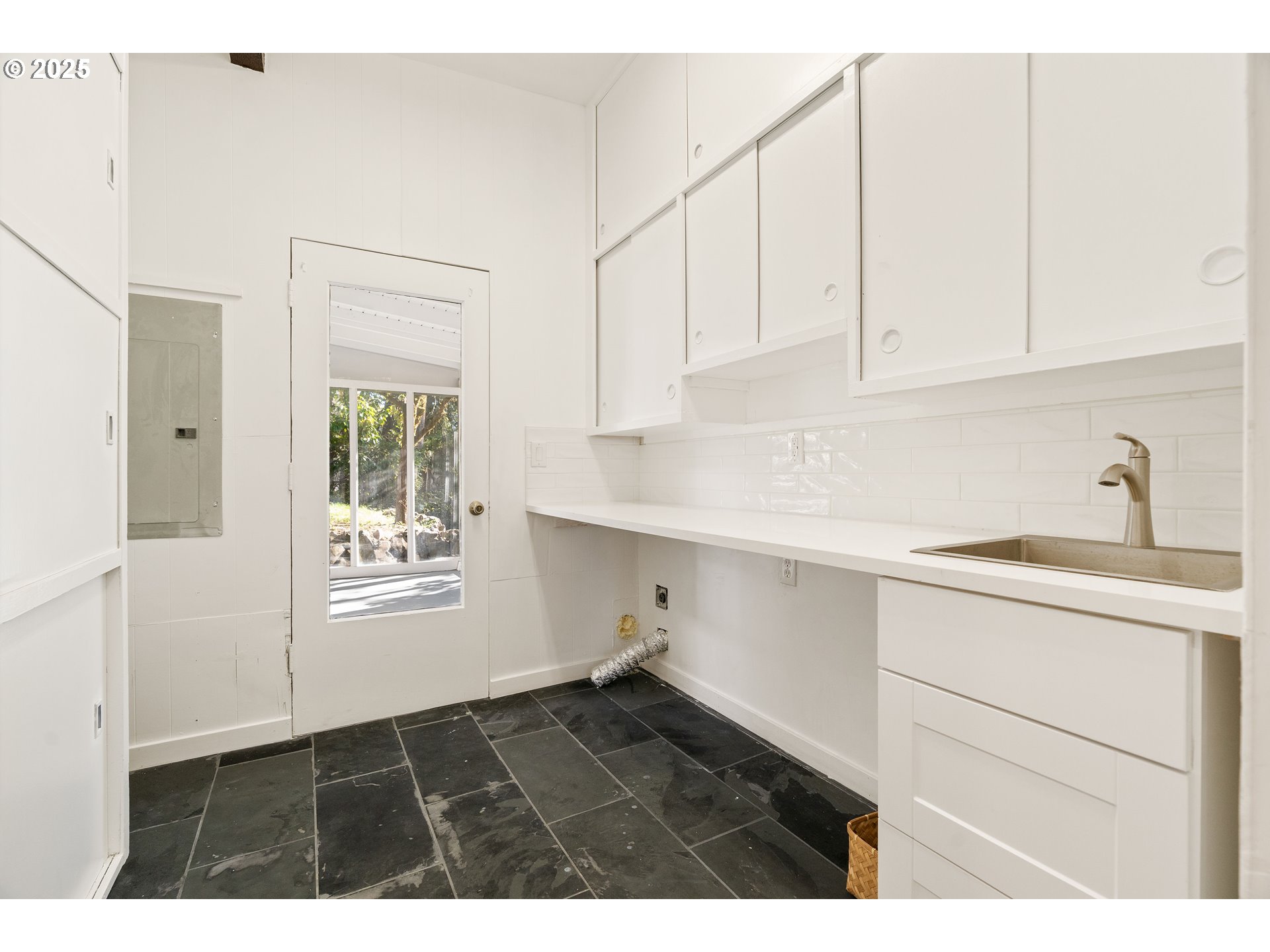 4778 Southeast Naef Road Milwaukie, OR 97267 - Photo 33 of 43 a kitchen with white cabinets and sink