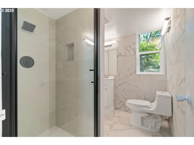 a view of backyard with deck and garden