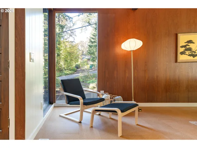a view of a room with a table and chairs