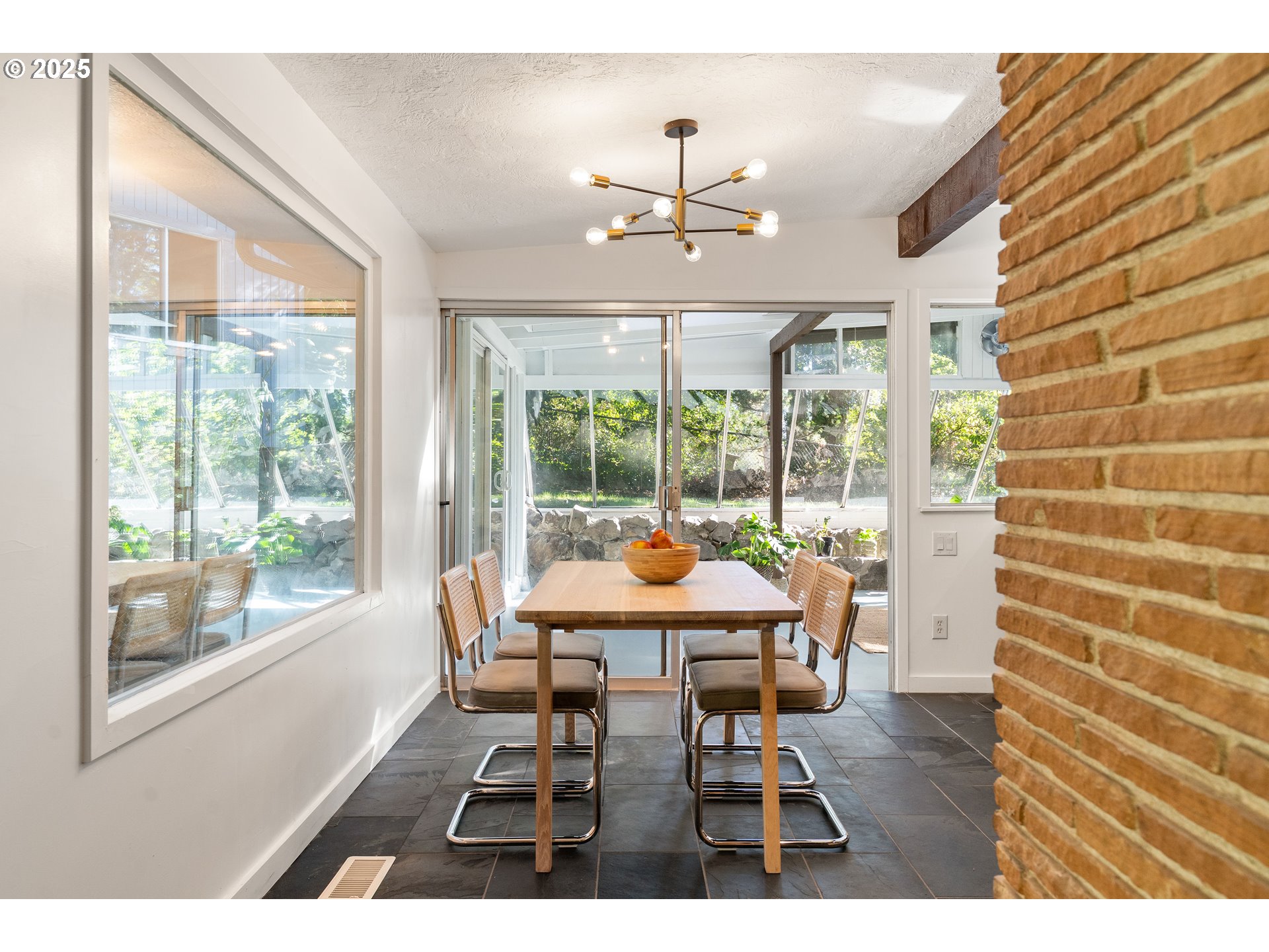 4778 Southeast Naef Road Milwaukie, OR 97267 - Photo 9 of 43 a dining room with furniture large windows and wooden floor