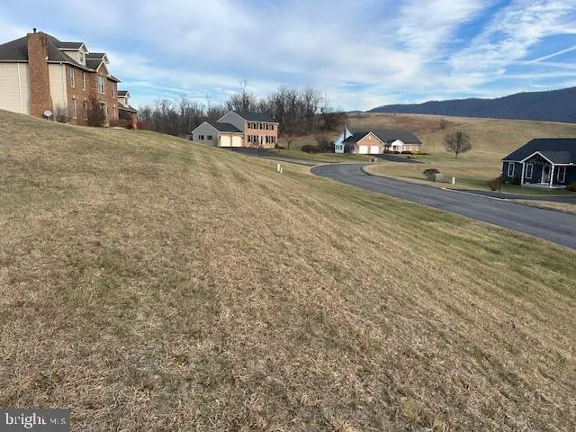 a view of car parked on road with building