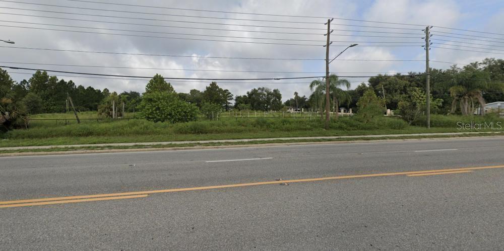 2104 Rock Springs Road Apopka, FL 32712 - Photo 7 of 9 a view of a green field