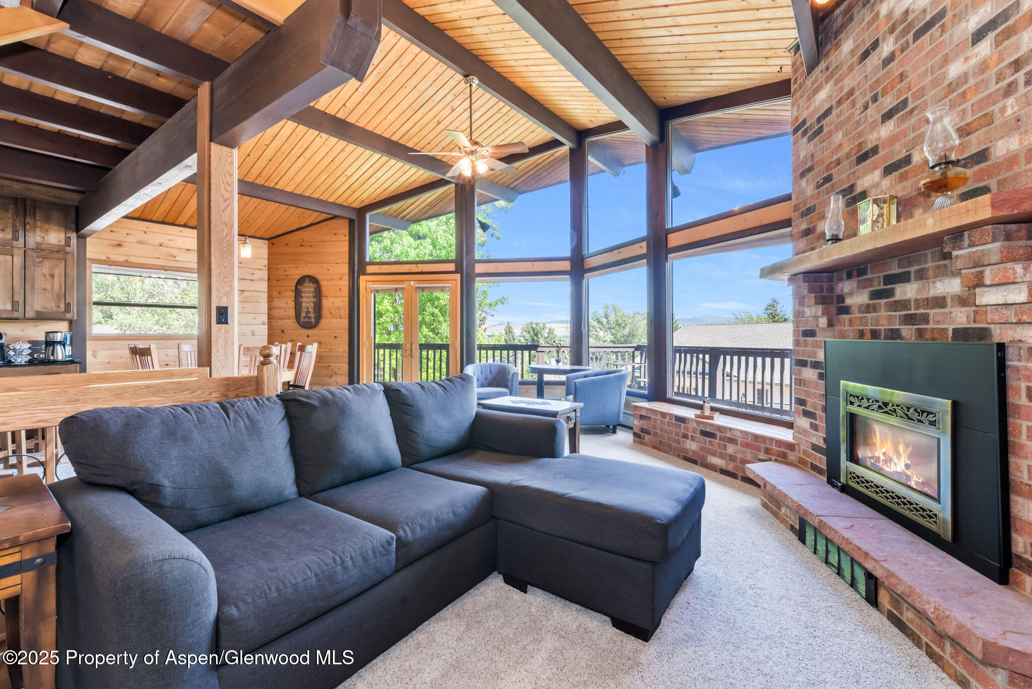 922 Steele Court Craig, CO 81625 - Photo 16 of 115 a living room with furniture a fireplace and a large window
