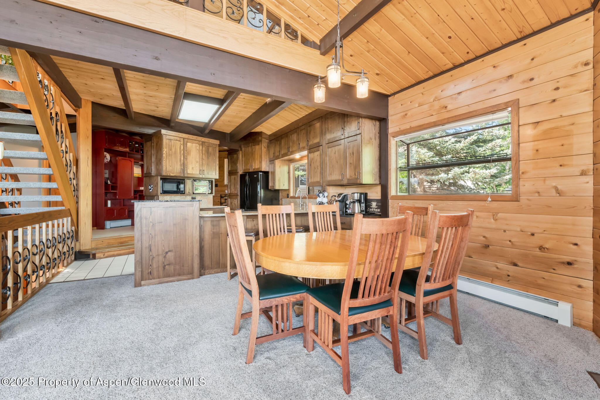 922 Steele Court Craig, CO 81625 - Photo 19 of 115 a dining room with furniture and a floor to ceiling window