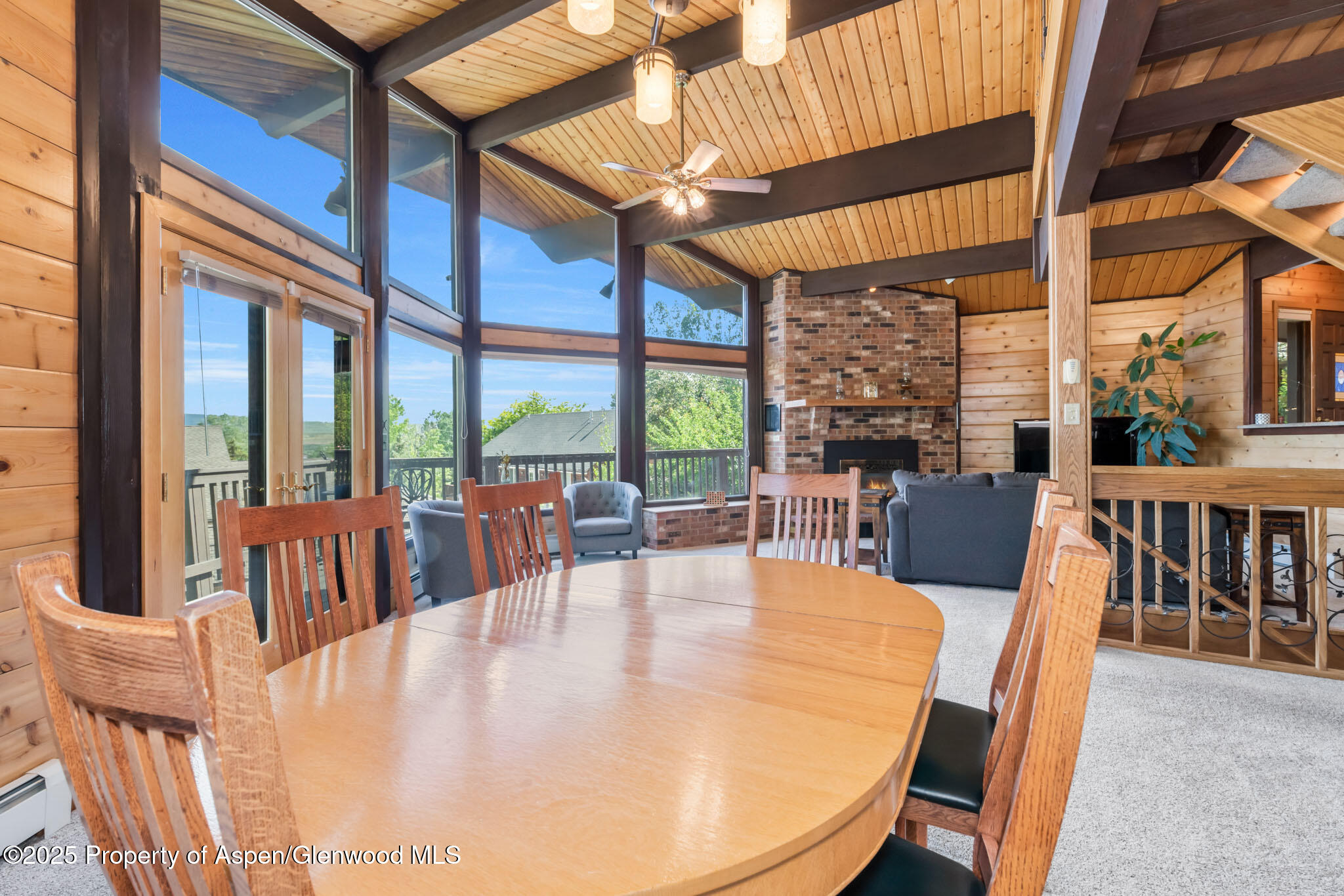 922 Steele Court Craig, CO 81625 - Photo 23 of 115 a dining room with furniture a chandelier and wooden floor