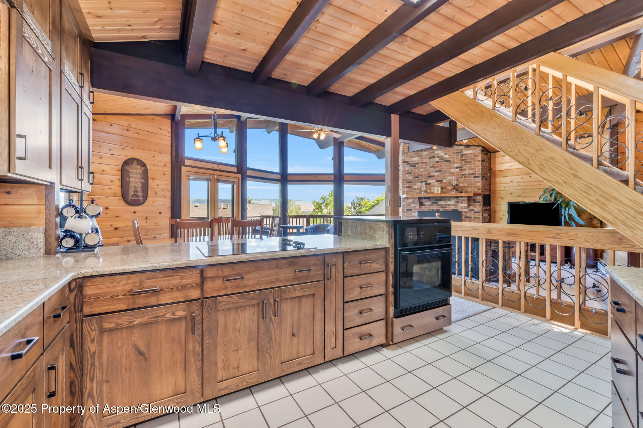 922 Steele Court Craig, CO 81625 - Photo 29 of 115 a kitchen with stainless steel appliances wooden cabinets and a stove top oven