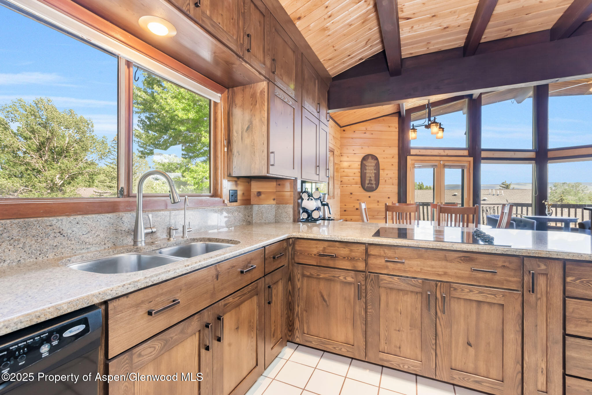 922 Steele Court Craig, CO 81625 - Photo 30 of 115 a kitchen with white cabinets and large windows