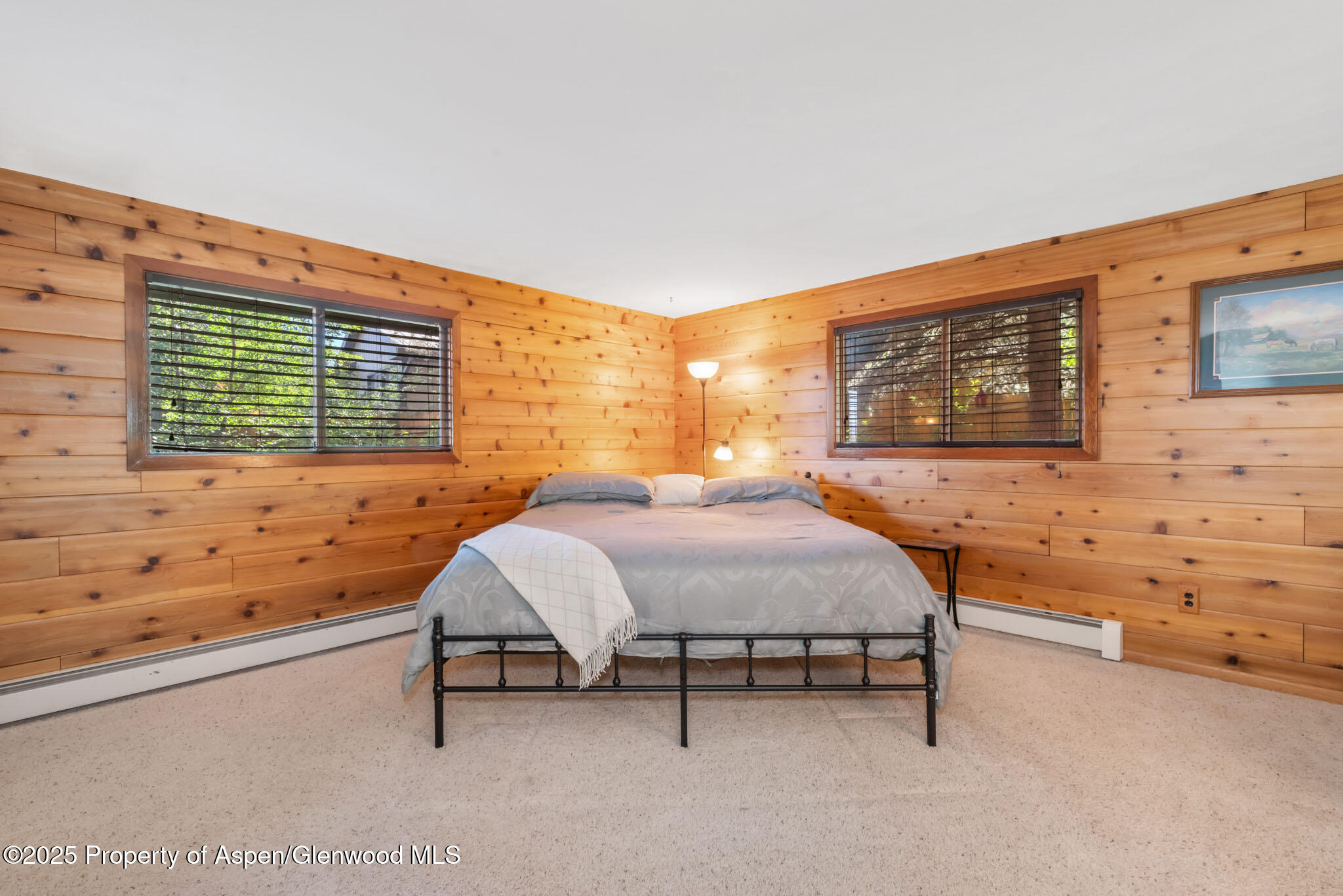 922 Steele Court Craig, CO 81625 - Photo 33 of 115 a bedroom with a bed and a flat screen tv