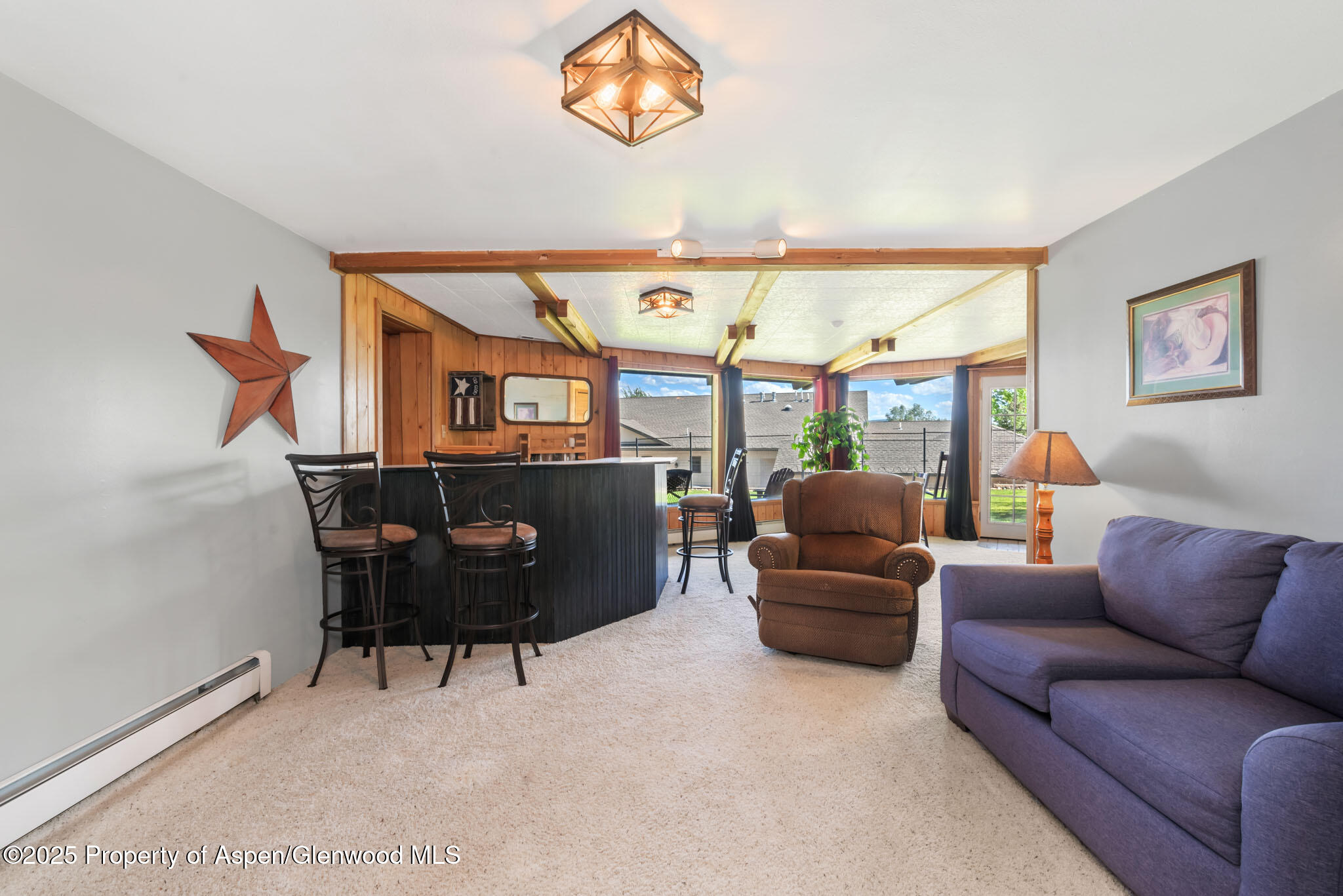 922 Steele Court Craig, CO 81625 - Photo 58 of 115 a living room with furniture and a large window
