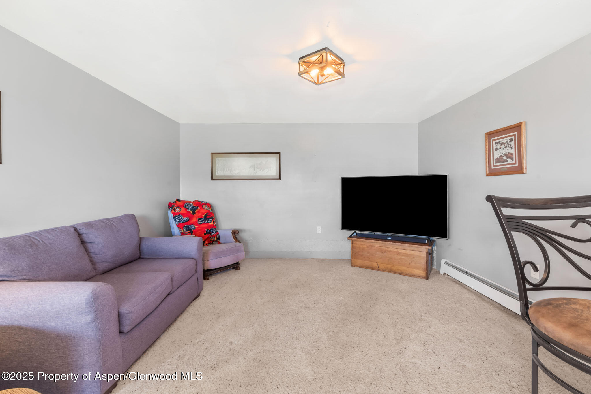 922 Steele Court Craig, CO 81625 - Photo 60 of 115 a living room with furniture and a flat screen tv