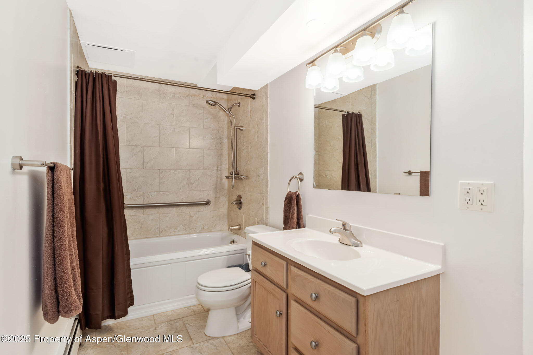 922 Steele Court Craig, CO 81625 - Photo 61 of 115 a bathroom with a sink a toilet a mirror and shower