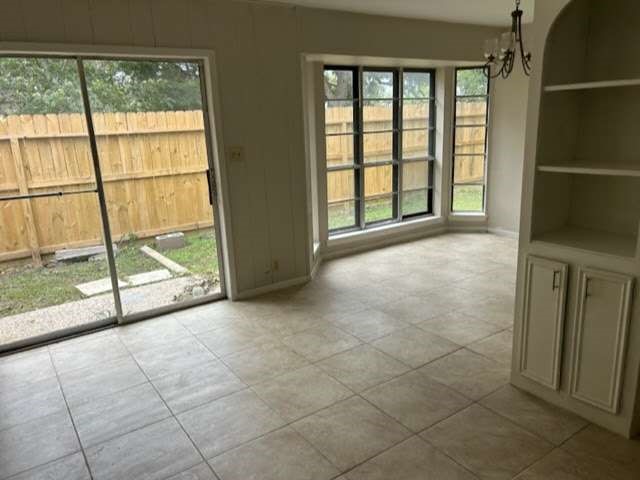 1200 Rugeley Street Bay City, TX 77414 - Photo 4 of 16 a view of an empty room and window a ceiling fan