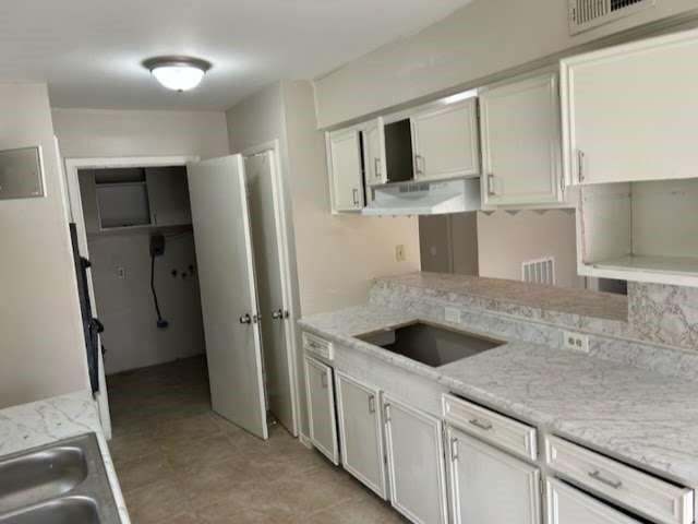 1200 Rugeley Street Bay City, TX 77414 - Photo 8 of 16 a kitchen with stainless steel appliances granite countertop a refrigerator and a sink