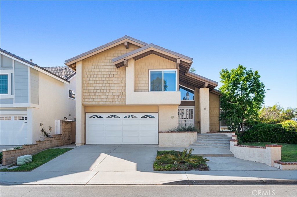 2 Glorieta East Irvine, CA 92620 - Photo 1 of 23 a front view of a house with a yard and garage